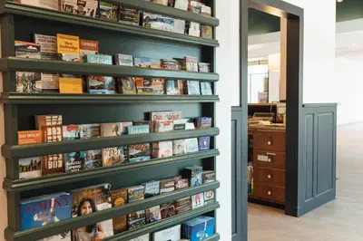 a book shelf filled with books at Hotel Downstreet, an Ascend Collection Hotel in North Adams