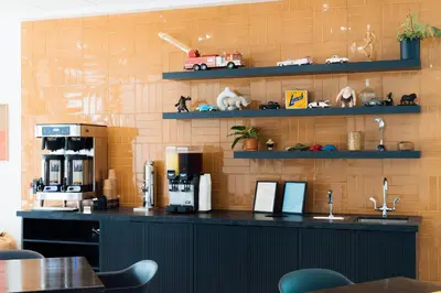 a kitchen with a counter with a coffee maker at Hotel Downstreet, an Ascend Collection Hotel in North Adams