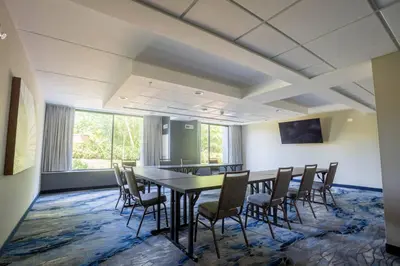 a conference room with a table and chairs at Fairfield Inn & Suites Springfield Enfield in Springfield