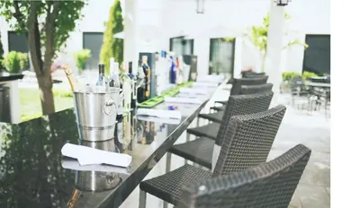 a row of tables and chairs with napkins on them at The Inn At Fox Hollow Hotel in Woodbury