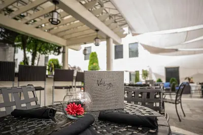 a table with a wine glass on top of it at The Inn At Fox Hollow Hotel in Woodbury