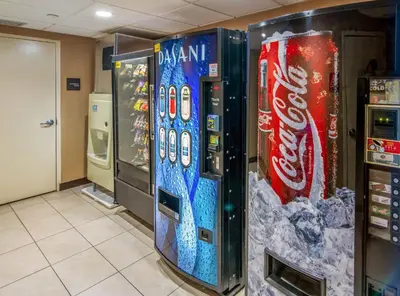 two vending machines in a room with cocacola machines at Red Roof Inn Meriden - CT in Meriden