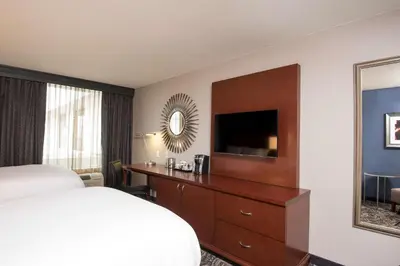 a hotel room with a bed and a television at DoubleTree by Hilton Schenectady in Schenectady