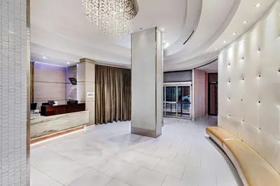 a lobby with a chandelier on the ceiling at Fairfield By Marriott New York Manhattan Times Square in New York