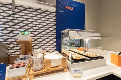 a display case with donuts and other pastries at Holiday Inn Express & Suites Albany Airport Area - Latham by IHG in Latham