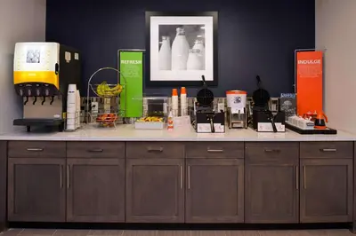 a counter with a bunch of products on it at Hampton Inn & Suites Albany-East Greenbush, NY in East Greenbush