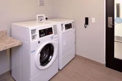 a white washer and dryer in a room at Hampton Inn & Suites Albany-East Greenbush, NY in East Greenbush