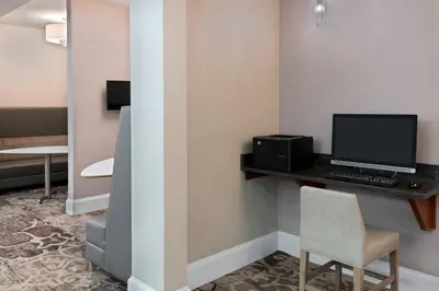 a room with a desk with a computer and a chair at Residence Inn Wayne in Wayne
