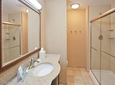 a bathroom with a sink and a shower at Hampton Inn Kingston in Kingston