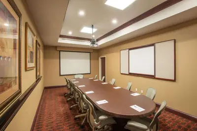 a conference room with a long table and chairs at Hampton Inn Kingston in Kingston
