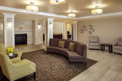 a living room with a couch and a fireplace at Homewood Suites by Hilton Wallingford-Meriden in Wallingford