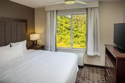 a bedroom with a bed and a large window at Homewood Suites by Hilton Wallingford-Meriden in Wallingford