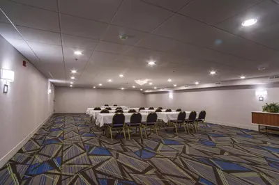 a conference room with a long table and chairs at Holiday Inn Express Branford-New Haven by IHG in Branford