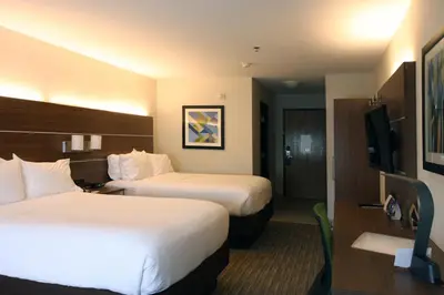 a hotel room with two beds and a television at Holiday Inn Express Branford-New Haven by IHG in Branford