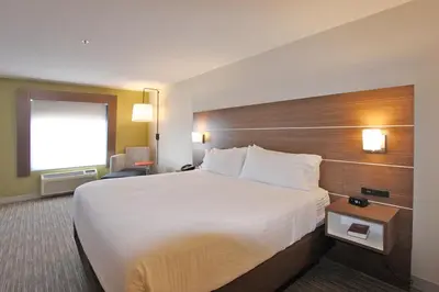 a hotel room with a large bed and a window at Holiday Inn Express Branford-New Haven by IHG in Branford
