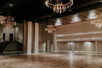 an empty room with chandeliers in a building at Arlo Williamsburg in Brooklyn