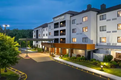 an image of the front of a hotel at night at Courtyard by Marriott Danbury in Danbury