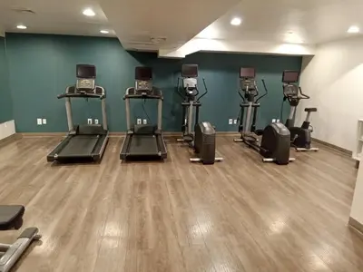 a gym with several exercise bikes in a room at Holiday Inn Express Maspeth by IHG in Queens