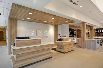 a store with wooden counters in a lobby at Hilton Garden Inn Ridgefield Park in Ridgefield Park