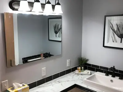 a bathroom with a sink and a mirror at Stamford Gables Bed and Breakfast in Stamford