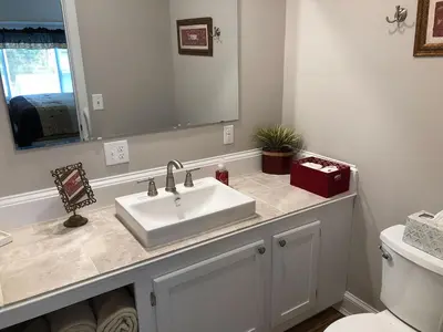 a bathroom with a sink and a mirror at Stamford Gables Bed and Breakfast in Stamford