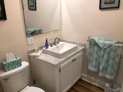 a bathroom with a sink and a toilet and a mirror at Stamford Gables Bed and Breakfast in Stamford
