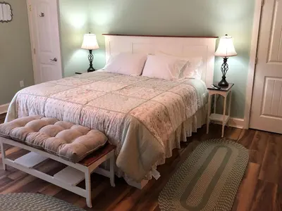 a bedroom with a large bed with two night stands at Stamford Gables Bed and Breakfast in Stamford