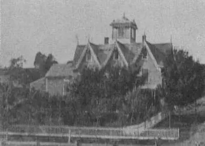 a black and white photo of a building with a tower at Stamford Gables Bed and Breakfast in Stamford