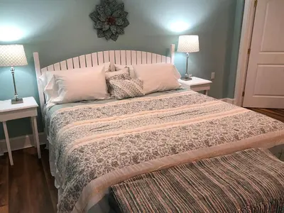 a bedroom with a large bed with pillows and two lamps at Stamford Gables Bed and Breakfast in Stamford