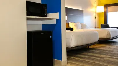 a hotel room with a bed and a tv at Holiday Inn Express & Suites Kingston-Ulster by IHG in Lake Katrine
