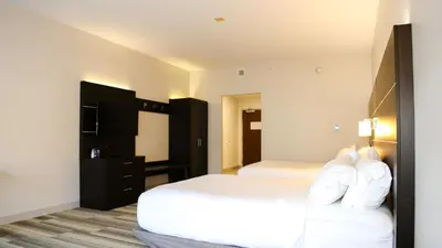 a hotel room with two beds and a couch at Holiday Inn Express & Suites Kingston-Ulster by IHG in Lake Katrine