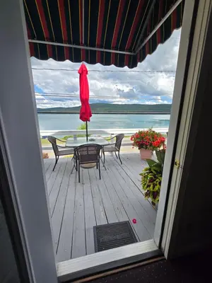 a view of a patio with a table and chairs at Lake View Motel in Cooperstown
