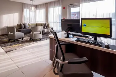 a room with a desk with a computer and a chair at Residence Inn by Marriott Fishkill in Fishkill
