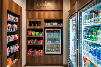a refrigerator filled with lots of drinks in a store at SpringHill Suites by Marriott Fishkill in Fishkill
