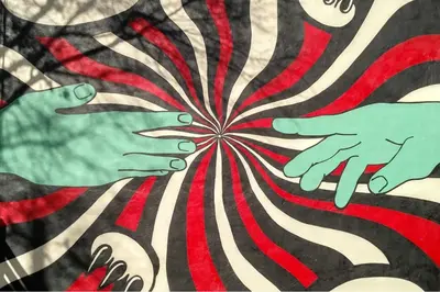 a painting of hands on a red and white stripes at Hotel 1080 in Brooklyn