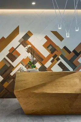 a reception desk with a painting on the wall at Hotel Zero Degrees Danbury in Danbury