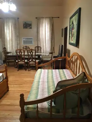 a living room with a bed and a dining room at Times Square Perfect Home in New York