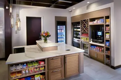 a pharmacyacist with a counter with flowers on it at Hilton Garden Inn Roslyn in Roslyn