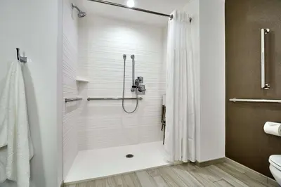 a bathroom with a shower with a shower curtain at Hilton Garden Inn Roslyn in Roslyn