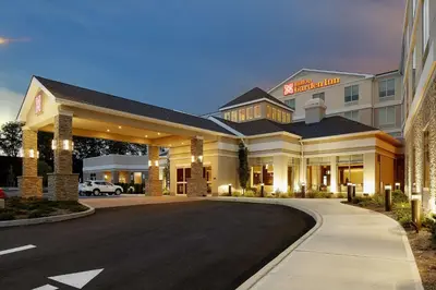 a hotel building with a road in front of it at Hilton Garden Inn Roslyn in Roslyn