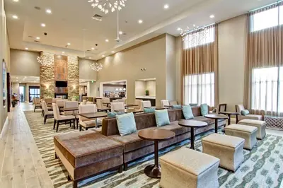 a lobby of a hotel with couches and chairs at Homewood Suites By Hilton Clifton Park in Clifton Park