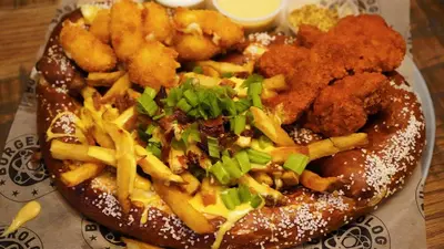 a plate of food with a sandwich and french fries at Crowne Plaza HY36 Midtown Manhattan by IHG in New York