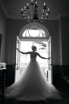 a woman in a wedding dress standing in a doorway at The Hotel Northampton in Northampton