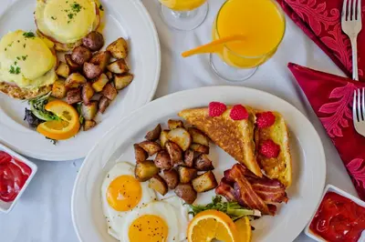 two plates of breakfast food on a table at The Hotel Northampton in Northampton