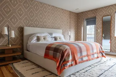 a bedroom with a bed with two dogs on it at Hunter Lodge, a Bluebird by Lark in Hunter