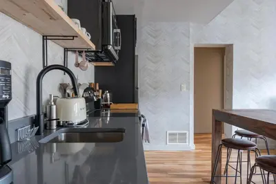 a kitchen with a sink and a counter top at Hunter Lodge, a Bluebird by Lark in Hunter
