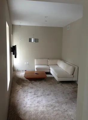a living room with a white couch and a coffee table at The Roundhouse in Beacon