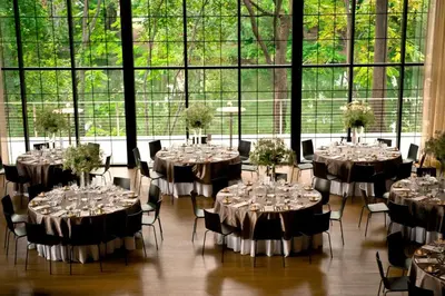 a room with tables and chairs with wine glasses at The Roundhouse in Beacon