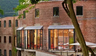 a brick building with a lot of windows at The Roundhouse in Beacon
