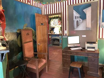 an office with a desk with a computer and a chair at Carlton Arms Hotel in New York